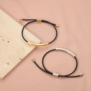 Adjustable woven rope bracelet set with sleek gold and silver curved stainless steel bars