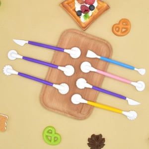 7-piece colorful fondant cake modeling tool set for creative baking on wooden tray