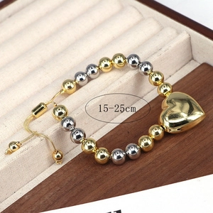 Bracciale con perline regolabile 15-25cm con ciondolo a cuore dorato su velluto
