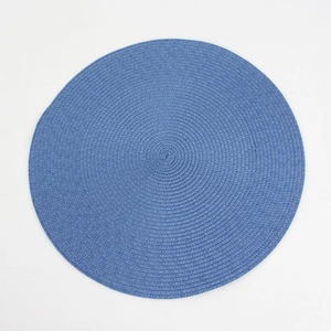 Macro detail of round blue woven placemat showing intricate texture and durable material