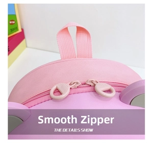 Detail of pink toddler backpack showing smooth double zipper and textured fabric
