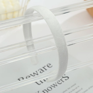 Close-up of white headband with ultra-soft fabric texture and minimalist design