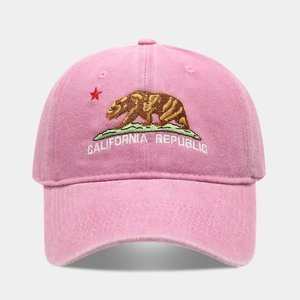Close-up of California Republic bear embroidery on a pink washed cotton baseball cap