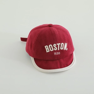 Detailed close-up of BOSTON 1630 embroidery on burgundy cotton baby baseball cap