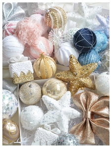 Detailed view of assorted Christmas ornaments with pink glitter and luxury textures