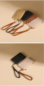 Detail of woven straw coin purses in beige black and brown with faux leather wrist straps