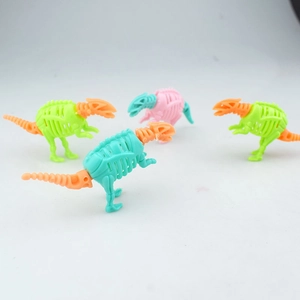 Top view of four colorful DIY dinosaur skeleton assembly toys in multiple vibrant colors