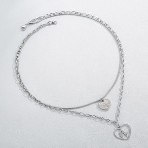 Silver double-layer heart necklace with textured pendant and couple silhouette design