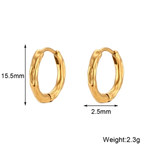 Detail view of gold irregular textured hoop earrings with dimensions 15.5mm by 2.5mm