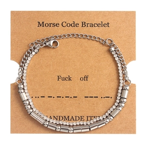 Detailed view of double-layer Morse code bracelet with crystals on a handmade card display