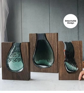Detail of detachable wood frame and dark green glass vase set for easy cleaning