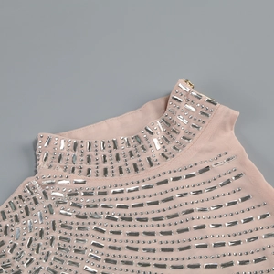 Close-up of pink mesh fabric with sparkling silver rhinestones and delicate texture