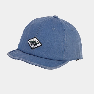 Detailed close-up of blue soft brim camping hat with traveling mountain patch embroidery