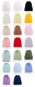 Detail view of small drawstring cotton pouches in twenty different assorted colors