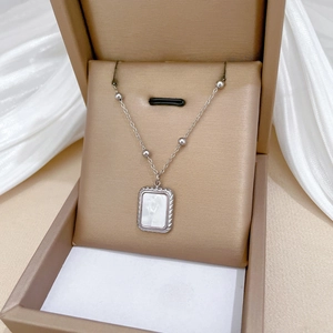 Silver steel necklace with rectangle shell pendant in a luxury brown gift box on silk