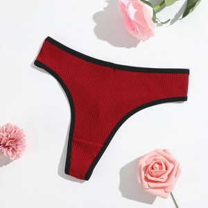 Red ribbed cotton thong with black trim on white background with pink floral accents
