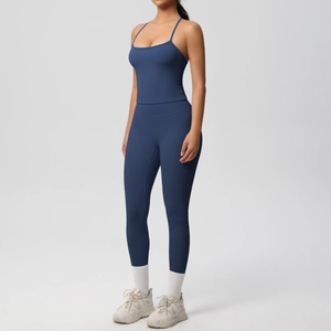 Detail of navy blue racerback yoga top and high-waist leggings with matte texture