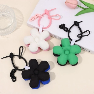 Three colorful floral flower keychains with matching lanyards on a neutral background