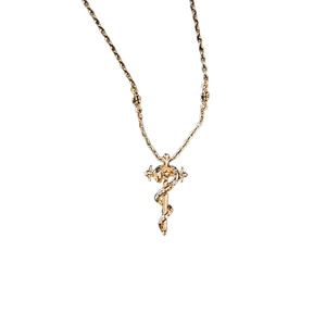 Vintage gothic gold snake cross necklace with crystals for a luxury aesthetic style
