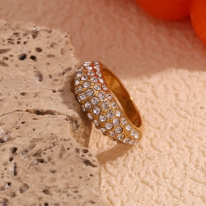 Detail of 18K gold-plated irregular ring with shimmering starry textured finish