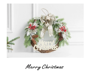 Close-up of Christmas wreath featuring pine cones, red berries and a Merry Christmas sign