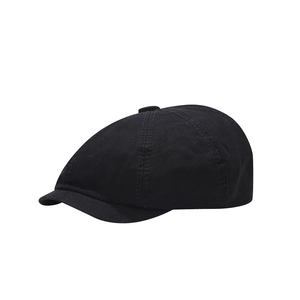Classic black newsboy cap in durable cotton canvas with a minimalist retro vintage design