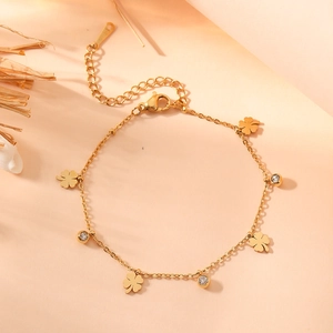 Elegant gold-plated clover necklace set with sparkling cubic zirconia and adjustable chain