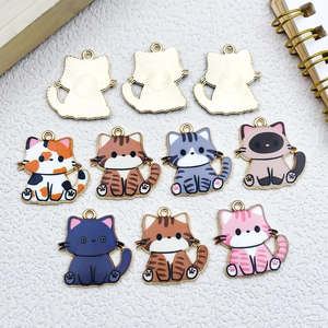 Detailed set of 10 enamel cat charms in varied colors with golden alloy finish