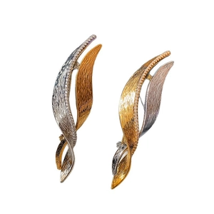 Sparkling zircon geometric twisted brooch with gold and silver leaf-shaped design