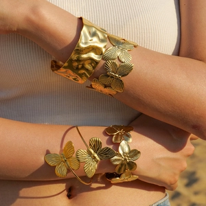 Golden stainless steel flower and butterfly bracelets set with hammer textured finish