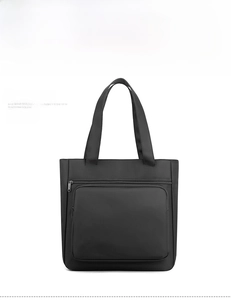 Front detail of black water-repellent nylon business tote bag with zipper pocket