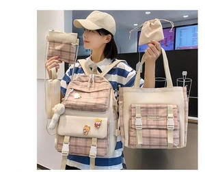 Detail showing pink plaid nylon 5-piece school bag set including backpack and tote bags