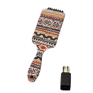 Bohemian geometric pattern air cushion massage hair brush with sleek black oil bottle
