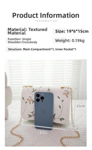 Size comparison of white floral embroidered small square bag next to a smartphone