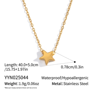 Detail view of gold star pendant necklace size and specifications on white background
