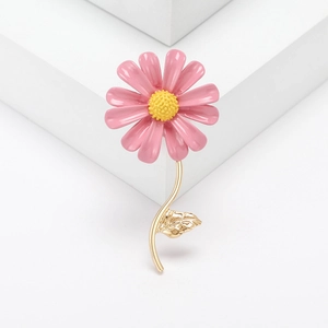 Minimalist pink daisy flower brooch with golden stem on a clean white background