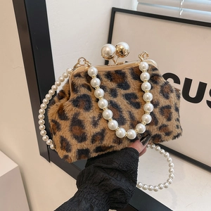 Leopard print faux fur shell bag with pearl handle and golden clasp closure