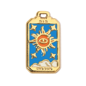 Macro shot of gold stainless steel Sun tarot pendant with vibrant colorful enamel inlay