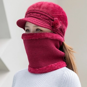 Detail of warm winter knit beanie and neck gaiter set with plush lining and fur trim