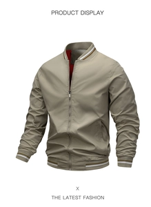 Detail of bomber jacket ribbed collar with brown and white striped trim and metal zipper
