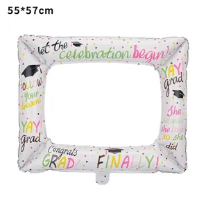 Detailed view of graduation theme foil balloon frame with festive motifs and grad messages