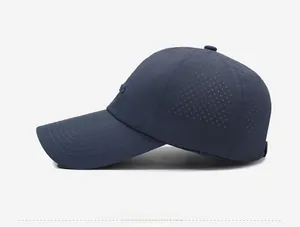 Detail of dark blue quick-dry baseball cap with laser-cut ventilation holes for breathability