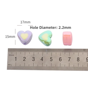 Macro view of 17mm UV-plated heart beads with 2.2mm hole for DIY jewelry making