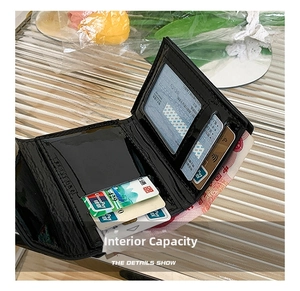 Internal layout of glossy black patent leather wallet showing multiple card slots and cash slot
