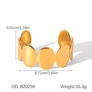 Detailed view of golden stainless steel cuff bracelet with width and weight measurements