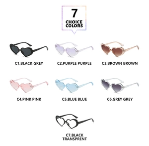 Collection of heart-shaped sunglasses in seven vibrant candy colors shown on white background