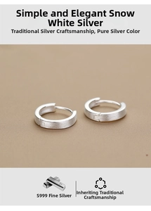 Detailed macro view of S999 sterling silver matte hoop earrings with brushed finish