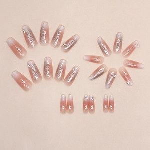 Long coffin press-on nails with pink gradient, silver butterfly patterns and rhinestones