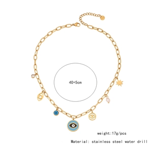 Detail of gold evil eye heart necklace with star and pearl charms on a white background