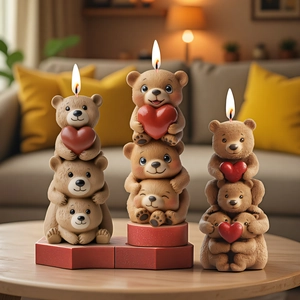Three stacked brown bear scented candles with red hearts in a warm home setting